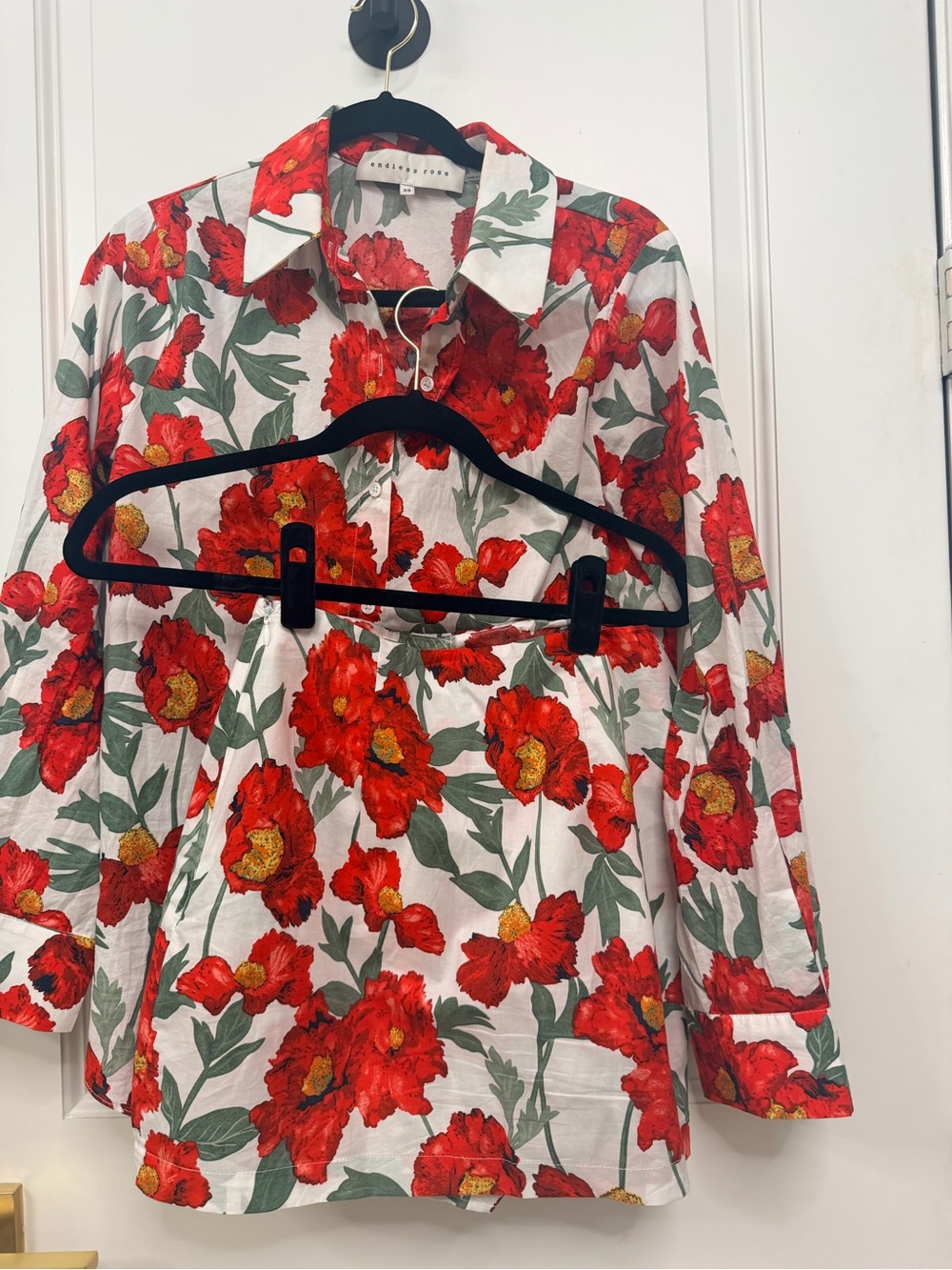 Endless Rose 2 piece.
White Button-Up with Red Floral Print top
and Skort Bottom